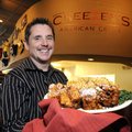 Richard LeBouff displays Cheezey’s American Grille’s Monte Cristo sandwich Tuesday at the new restau...