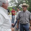 Mark Weathers, right, talks on Friday with Benton County Judge Bob Clinard.

