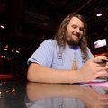 Sam Gallagher checks a driver’s license of a patron Thursday at the entrance of George’s Majestic Lo...