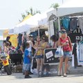 Visitors to the second Bikes, Babes & Bling motorcycle rally sort through vendors’ items Saturday.

