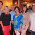 Big Brothers Big Sisters of Northwest Arkansas honorees Greg and Hanna Lee, center, are joined by Ju...