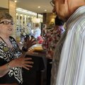 Andra Atteberry, left, with the Bella Vista Library Board of Trustees, talks Sunday to Ken Bloom of ...