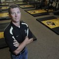 Scott Passmore stands in the weight room at the Tiger Athletic Complex in Bentonville on Friday. Pas...