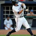Northwest Arkansas’ Kurt Mertins connects for a double in the second inning Monday against the Tulsa...