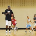 Ronnie Brewer directs a drill Monday during the Brew Crew Basketball Camp at the Donald W. Reynolds ...