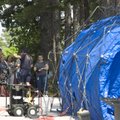 Fayetteville firefighters explain the procedure for decontamination Monday to employees of the Depar...