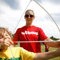 Taylor Kennedy, 8, of Fayetteville draws a bow with a “safety” arrow with instruction from Danielle ...