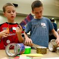 Excalibur Bunker (left), 8, and his brother, Xavier Bunker, 10, both of Bentonville, construct brace...