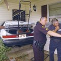 Sgt. Brad Pollock with the Rogers Police Department and tow truck operator Charles Capps of C&R Towi...