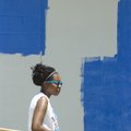 Amanda Maxwell, 15, paints a wall at Wilson Pool on Wednesday with a group of volunteers, hosted by ...