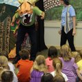  FOLK TALES Dennis Goza, left, as a dragon, and Kimberly Goza, both with Act!vated Story Theatre, pe...