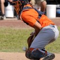 Rogers Heritage catcher Forrest Ward blocks pitch in the dirt on June 6 during a Northwest Arkansas ...
