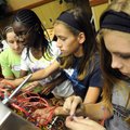  McNair Middle School students Haley Womack, 13, left, E.J. Ogbeide, 12, Katherine Litaker, 12, and ...