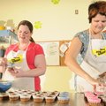  Erin Hague, left, and Andrea Rader put unsweetened frosting on a batch of pupcakes Tuesday at Bigwa...