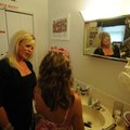  Beth Main helps daughter Kayla, 13, get ready Thursday before a Single Parent Scholarship Fund even...
