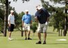  Arthur Baldwin, from right, celebrates a made putt as his son Aaron Baldwin and brother Ken Baldwin look on on the third green in the Chick-A-Tee golf tournament Friday at Springdale Country Club