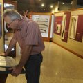  Rodney Jackson of Siloam Springs, a member of the Sons of Confederate Veterans, reads a 14-year-old...