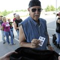  Carl Bennett of Little Flock draws his first poker run card Saturday before the start of the Armed ...