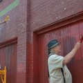 Donald Choffel (left), owner of the Dickson Street Bookshop, and his brother Gerald Choffel work on ...