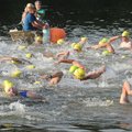 Men 39 and under begin a 1,000-yard swim at the start of the ninth annual Ozark Valley Triathlon at ...