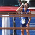 Chandra Owen of Rogers hydrates before transitioning to her bicycle in the ninth annual Ozark Valley...