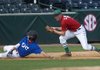 Greenland’s Jordan Larkin, right, catches Ryan Johnson of Abundant Life High School at third base Monday during the Arkansas High School Coaches Association All-Star Baseball Game in Baum Stadium in Fayetteville.