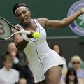 Serena Williamreturns a shot to France's Aravane Rezai at the All England Lawn Tennis Championships ...