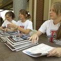 Farmington High School cheerleaders Kassidy Rice, left, Megan Grumieaux and Nicole Carney sell progr...