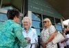 Tommie Hensen, from left, chats with Pat Walker and Carrie Eggart on Monday after the grand opening celebration of the EOA Children’s House in The Pat Walker Center for Children in Springdale. The facility aids children as they try to break the cycle of child abuse and neglect. A tour was given of the inside of the facility, which is usually closed to the public.