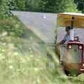 A day for hay Larry Woodward uses a tractor to cut hay Wednesday at a small field in Farmington. Tem...