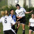 The West’s Margaret Power of Bentonville attempts a header on goal off a corner kick Tuesday over th...