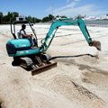 James Wilson, with the Springdale School District, digs a hole on Tuesday to repair a collapsed pipe...