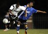 The West’s Pablo Castillo, left, of Siloam Springs breaks past the the East’s Williams Hidalgo of Cabot on Tuesday, during the first half of the Arkansas High School Coaches Association All-Star Boys Soccer Match at Razorback Field in Fayetteville.