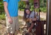 Zach Callaway (left) and Danielle Frechette, recent University of Arkansas at Fayetteville graduates, check their flash-flood warning device Tuesday afternoon at Devil’s Den State Park campgrounds in south Washington County.