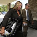 Lauren West, left, former Bentonville High School athletic director, arrives at the Bentonville Scho...