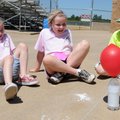 Girls Scouts, from left, Aleca White, 8, Amelia Bradley, 8, and Sierra Dorsey, 7, watch on Wednesday...