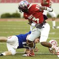  Fayetteville’s Chris Smith watches as Seth Keese of Harding Academy loses his helmet after a hard h...
