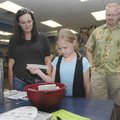  Grimes Elementary student Vada Ledbetter selects a prize for her reading accomplishments while at t...