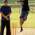  Cricket bowler Bimal Viswam makes his run up to throw in a pre-league match at Dock Wheeler Park in...