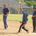  Cricket bowler Deepak Pavithran throws in a pre-league match at Dock Wheeler Park in Rogers, Ark. S...