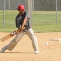  Cricket striker Reny Thankappan swings at the bouncing ball in a pre-league match at Dock Wheeler P...