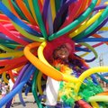  Mark Wetzel, "Sparky" from Hot Springs marches in a head-to-toe costume of balloons during the Prid...