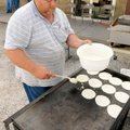  Terry Smith makes the pancakes for the annual Rodeo of the Ozarks Pancake Breakfast at the Rodeo Co...