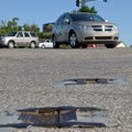 A couple of old metal plowable pavement markers sit at the corner of East Randall Wobbe Lane and Nor...