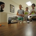 Sammie Garcia, 11, left, Taber Lobaugh, 11, Lela Minor, 11, and Christie Sharkey, 10, perform a tria...