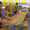 Alicia Manrriquez, 10, helps her family set up the Hale’s Fireworks tent on Old Missouri Road in Spr...