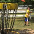 Jarod Showalter, 11, of Fayetteville takes his turn tossing the disc Monday during the Outdoor Adven...