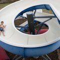 Sliding around Jack Rose, 7, of Fayetteville plunges down a water slide Monday afternoon at the Spri...