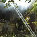 Fayetteville firefighters work on Monday at the scene of a house fire at 102 Plainview Ave. About th...