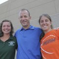 Elmwood Middle School girls basketball coach Amber (Melton) Tebbenkamp, left, and Rogers Heritage gi...